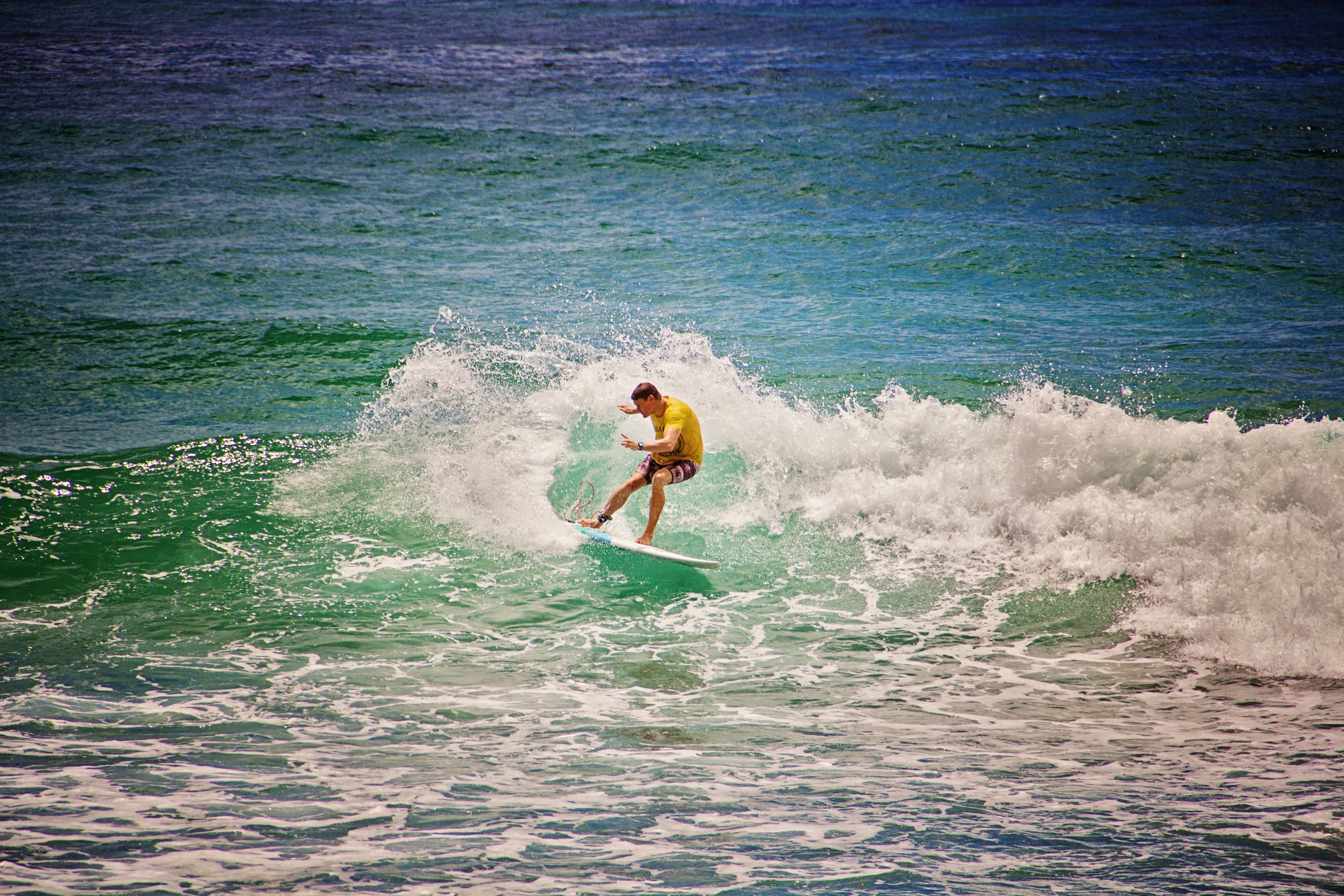 Surfer riding a wave, the world StrictlySurf serves